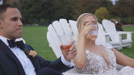 Bride-and-groom-relax-sipping-drinks-together