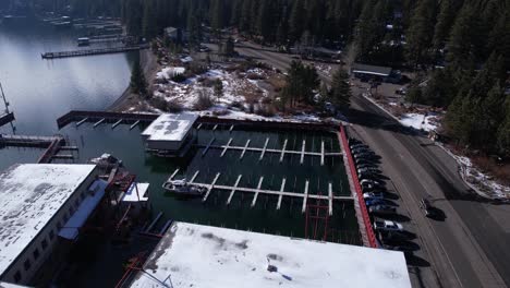 Aerial-View-of-Carnelian-Bay-Marina-and-Road-Traffic,-Lake-Tahoe,-California-USA