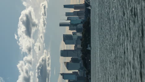 sydney, australia city skyline as seen from a ferry - vertical hyper lapse