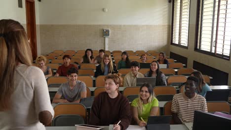 faceless woman teaching students at class