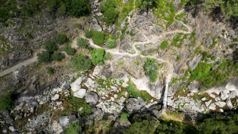 Geres-National-Park-River-and-Waterfall-Landscape-in-Fafião,-Captured-on-a-Sunny-Day-with-Green-Trees---Top-Down-View