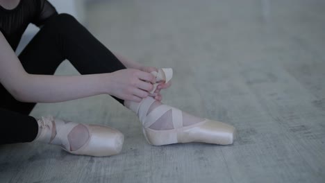 young ballerina practicing dance moves in studio