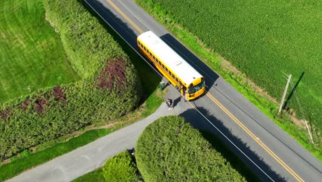 students exiting yellow school bus after school