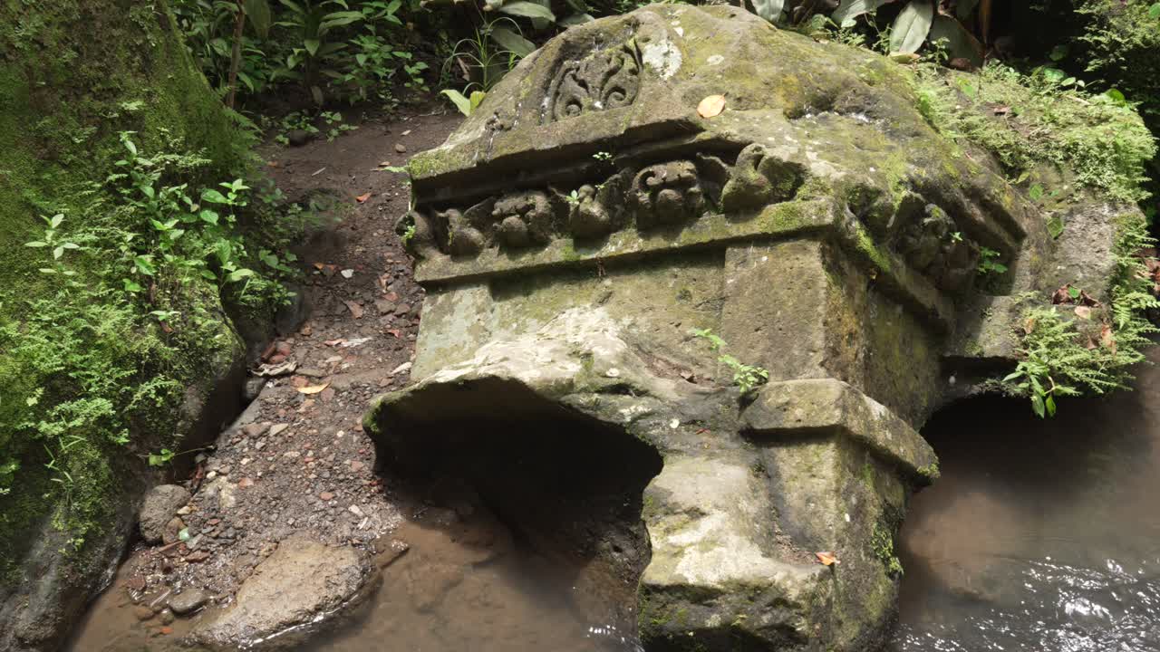 Ancient temple ruins Goa Gajah abandoned excavated stone carving Bali Ubud landmark Indonesia