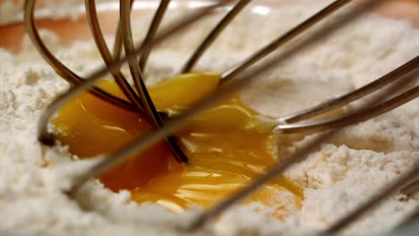 minimal-shot-of-coffee-grains-pourred-from-a-speical-spoon-in-slow-motion-with-haze-and-light-rays