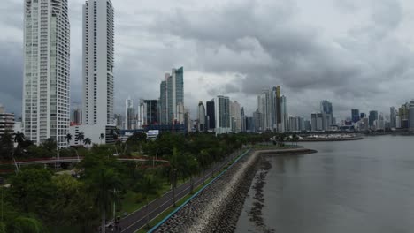 aerial flyover over the scenic cinta costera coastal recreation trail in downtown panama city