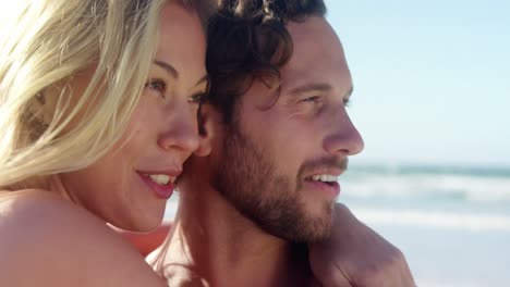 couple embracing each other at beach
