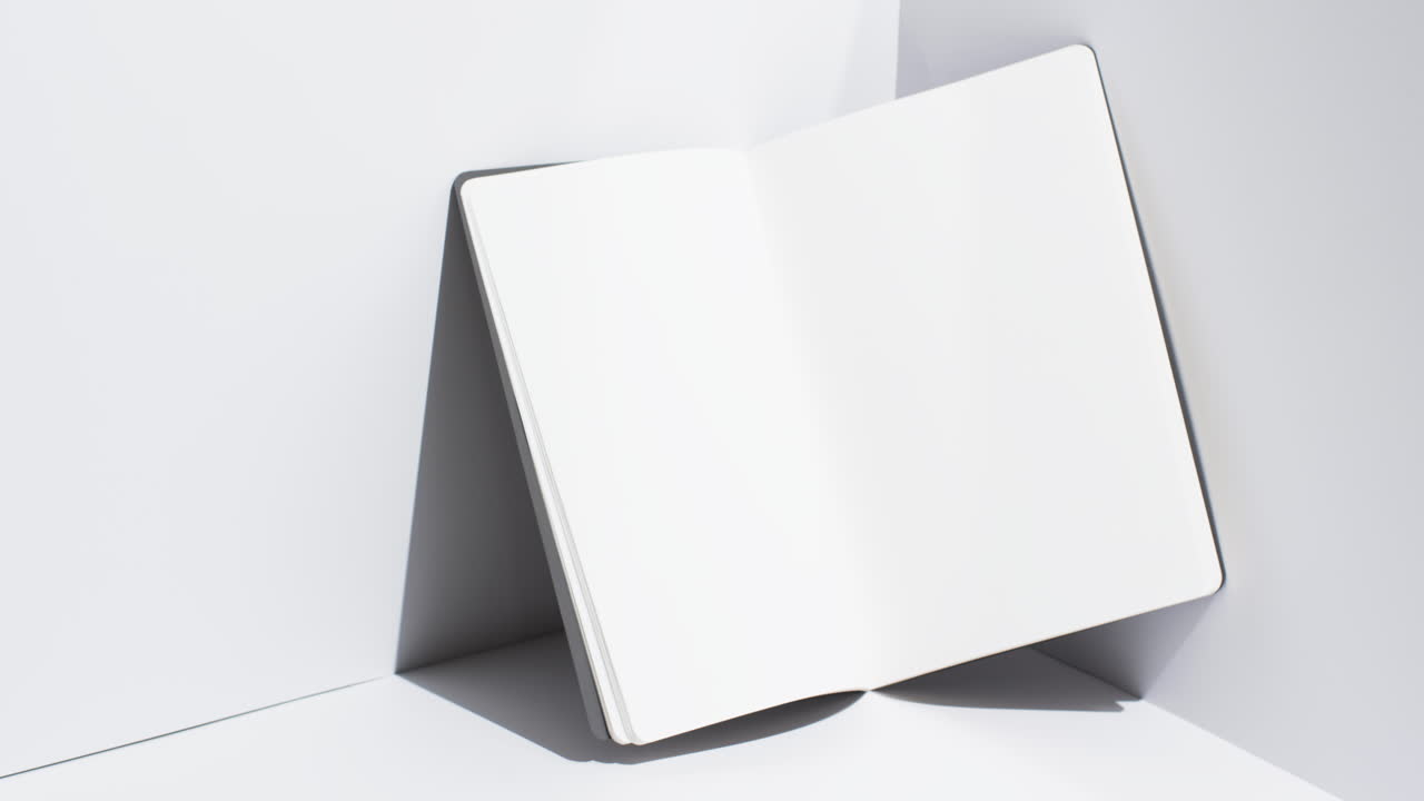 Video of book with white blank pages and copy space on white background