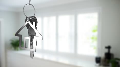 Animation-of-key-with-keychain-in-shape-of-house-over-kitchen-interior