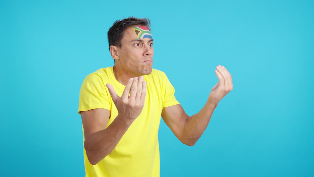 Man cheering for South Africa, angry with the decision of referee