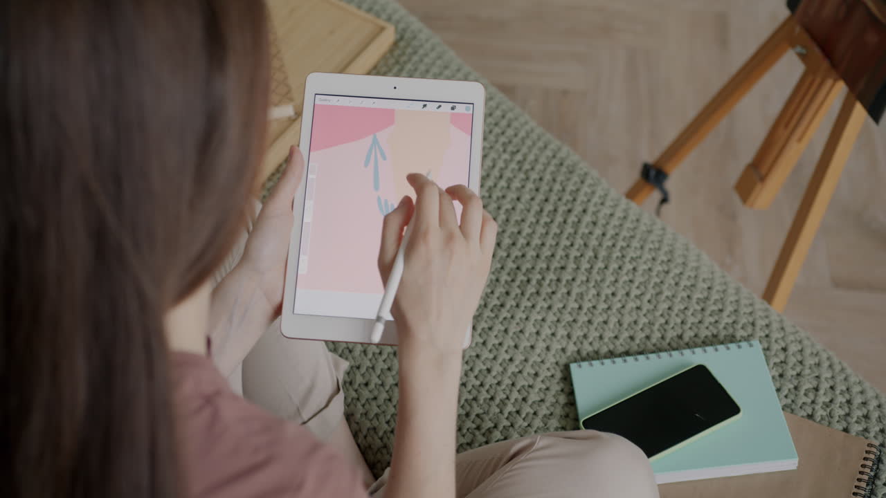 Woman Drawing on Tablet