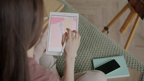 woman drawing on tablet