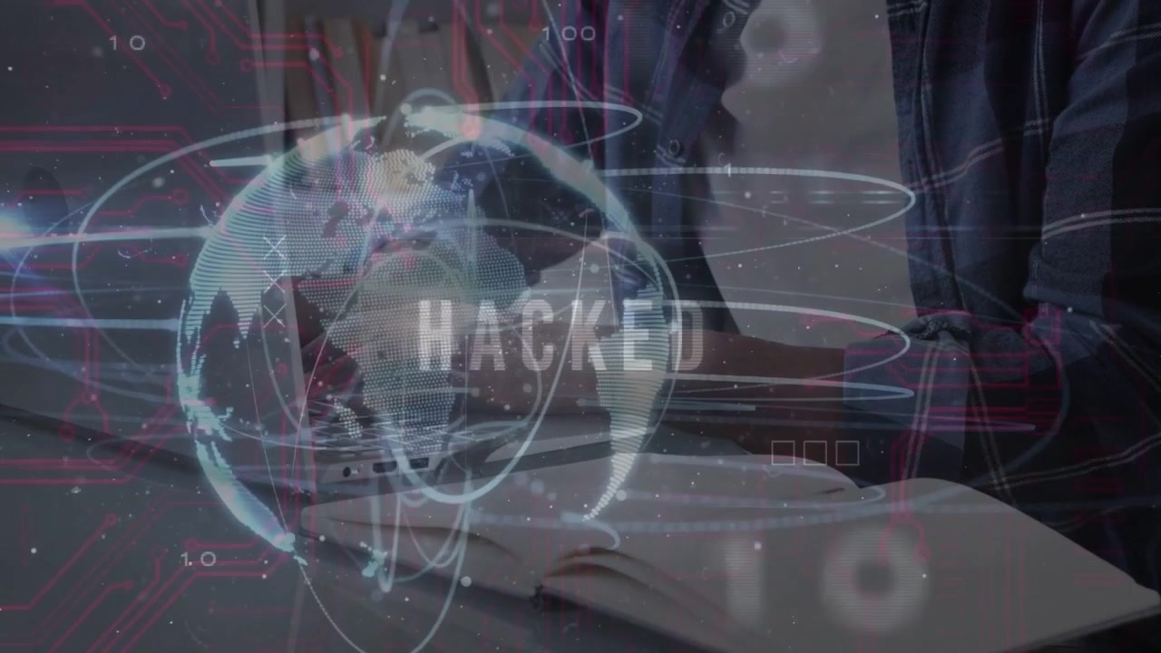 Man typing at desk reacting to security breach with hologram over laptop flashing HACKED label