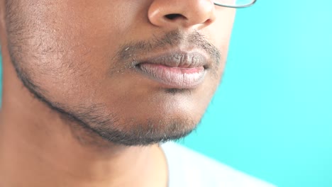 close-up portrait of a man with a beard and glasses