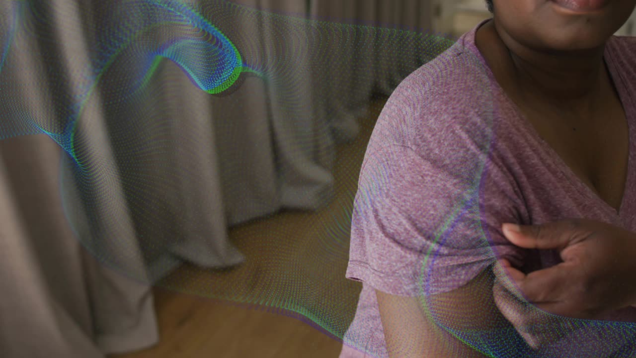 Woman lifting sleeve to reveal upper arm, pressing bandage after vaccine as overlay sweeping across