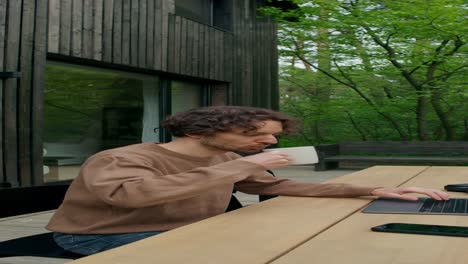 man working from home in backyard