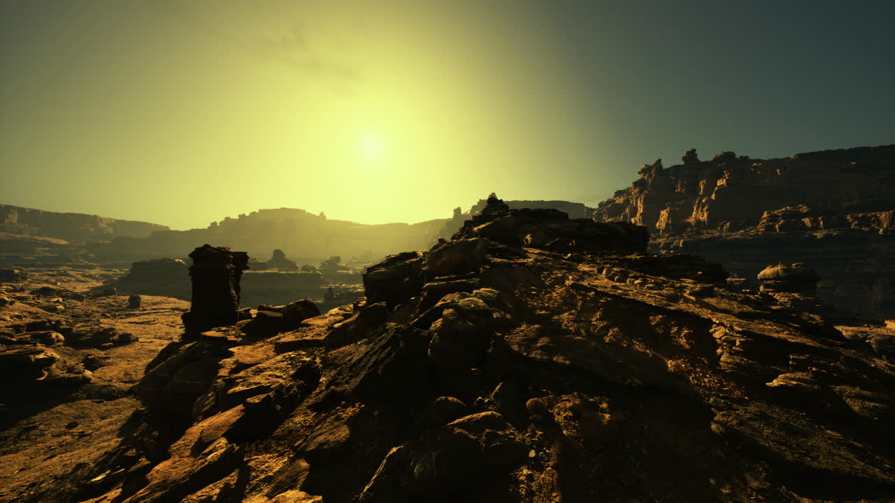 Sunset over rocky landscape in an arid region with dramatic terrain