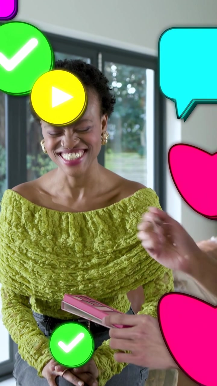 Vertical video: MUA picking pink palette applying makeup on woman for demo as icons obscuring view