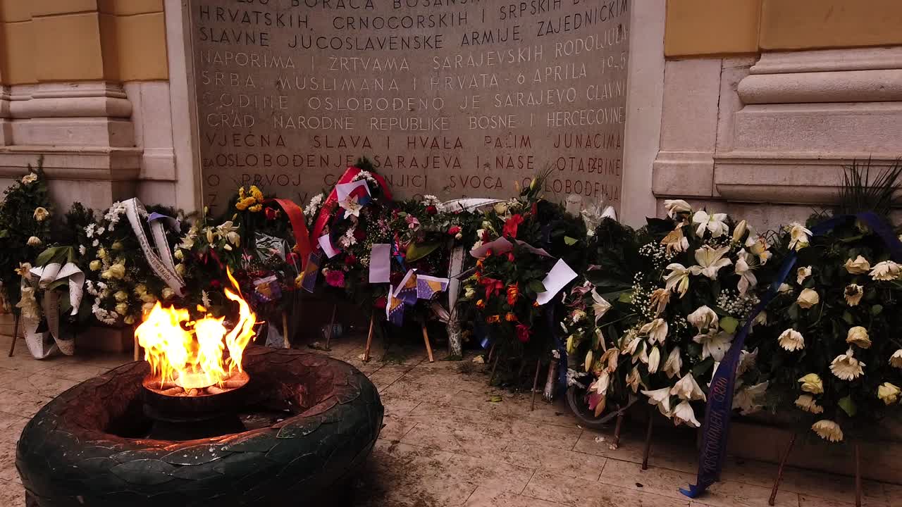 The Eternal flame in Sarajevo, a memorial to the military and civilian victims of the World War Two. Street, monument. Camera movement