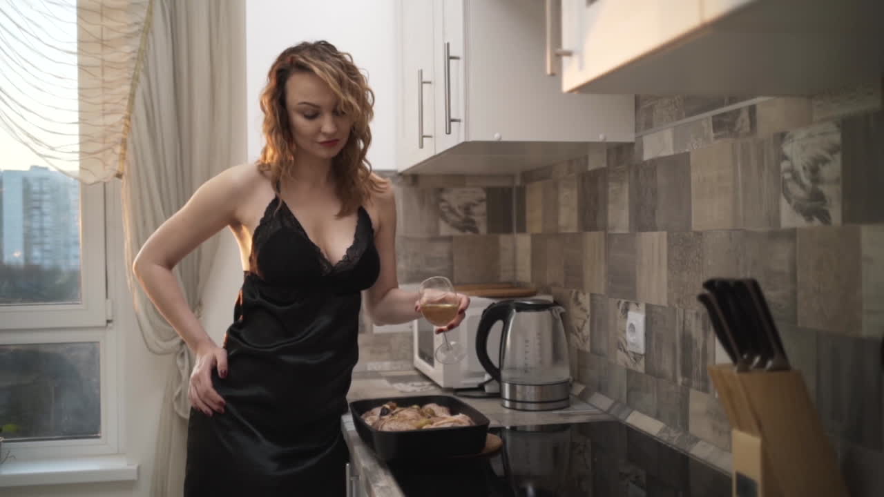 Woman Cooking a Roasted Chicken in the Kitchen