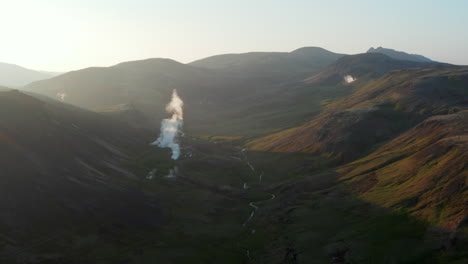 Reverse-birds-eye-aerial-view-of-Thorsmork-mountains-and-river,-highlands-of-Iceland.-Stunning-drone-view-of-icelandic-countryside.-Amazing-in-nature