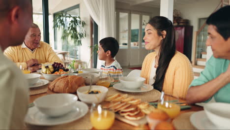 big family, lunch and talking at dinner table