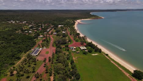 overhead moving aerial clip of remote community coastline in northern australia