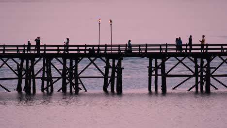 the mon bridge is an old wooden bridge located in sangkla, thailand