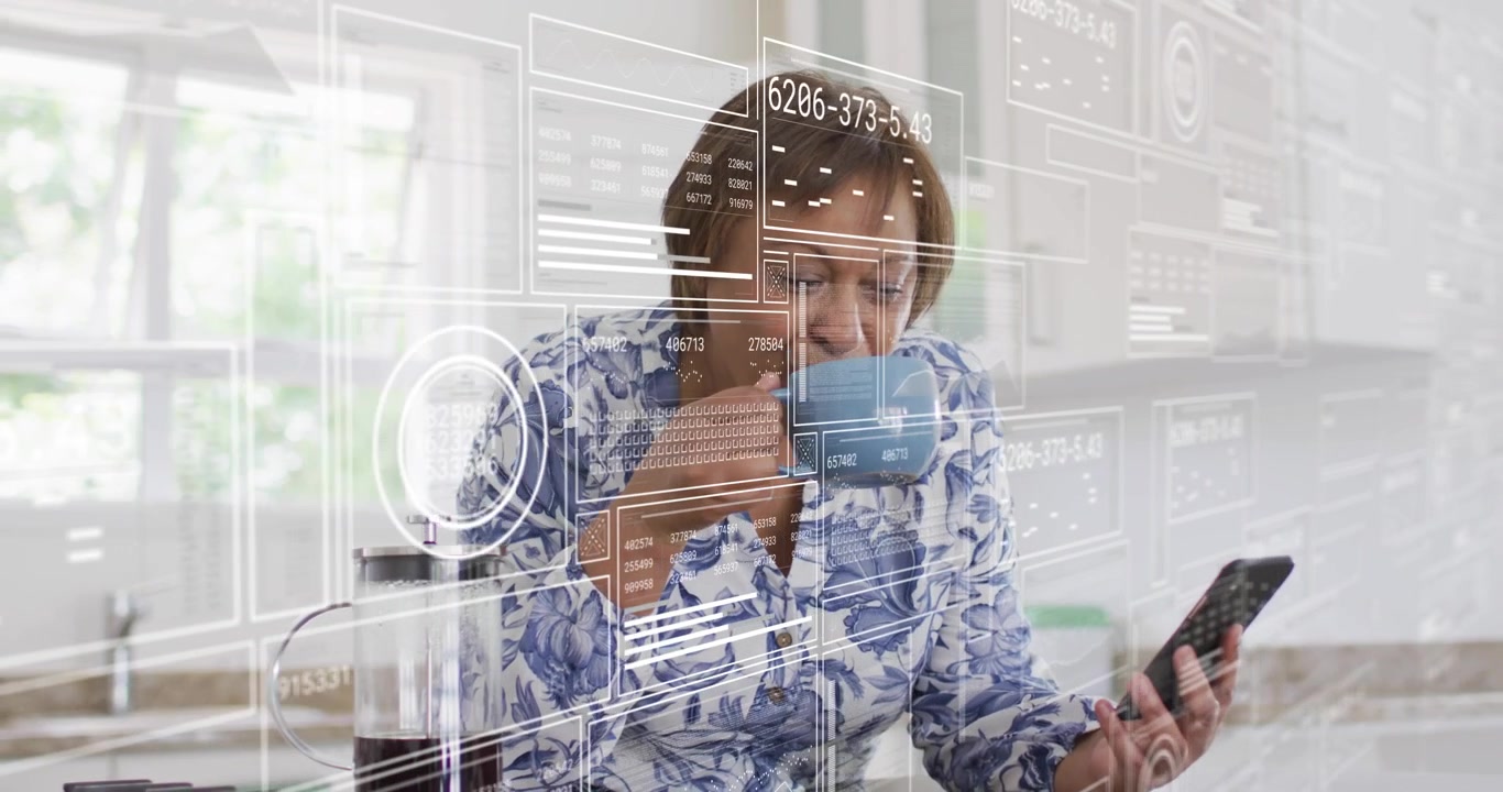 Mature woman glancing smartphone screen, sipping coffee while tech overlay displays analytics