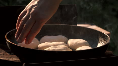 cooking homemade bread outdoors