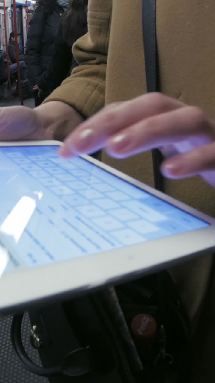 Using a Tablet on the Subway