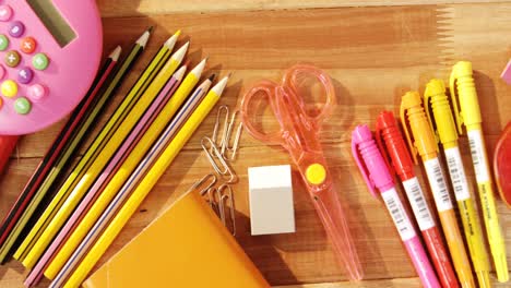 close-up of various stationery and apple