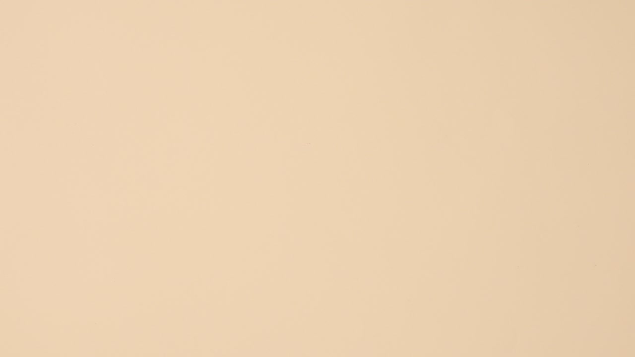 Wellness spa beauty products with towels ordering on left and right side on beige background with copy space. Stop motion flat lay