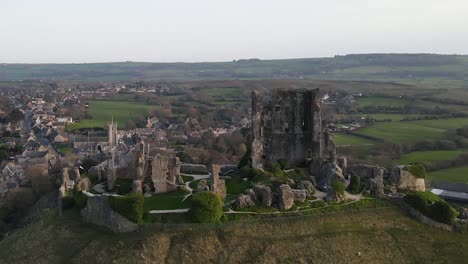 corfe castle ruins and beautiful landscape in background, county dorset in united kingdom