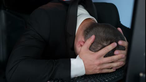 Angry businessman at computer