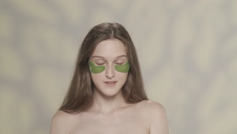teenage girl with green eye patches