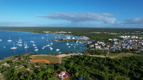 Stunning-view-in-a-caribbean-coast-with-boats-and-a-small-baseball-playground