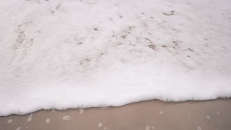 a beach sand wave clean