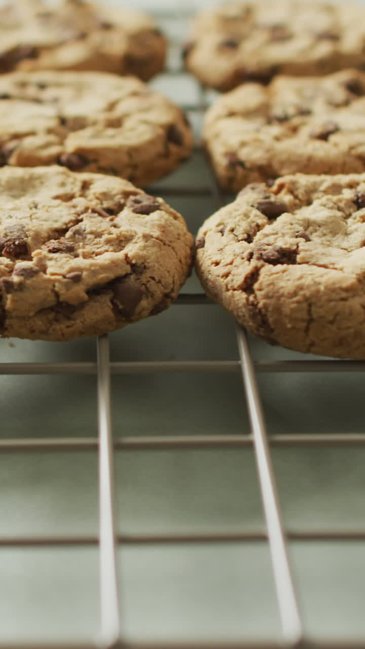 Video of rows biscuits on a baking rack over white background