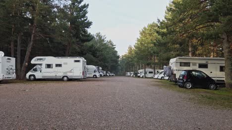 motor homes parked at camping car park, matemale park, france. pan right