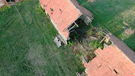 Ruins-of-a-destroyed-large-barn-cracked-in-half