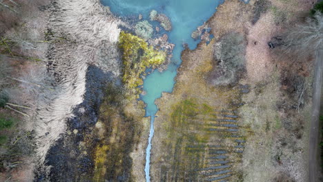 Top-Down-Floyver-of-Blue-Glacial-Lake,-Egelsee-,-Zurich,-Switzerland