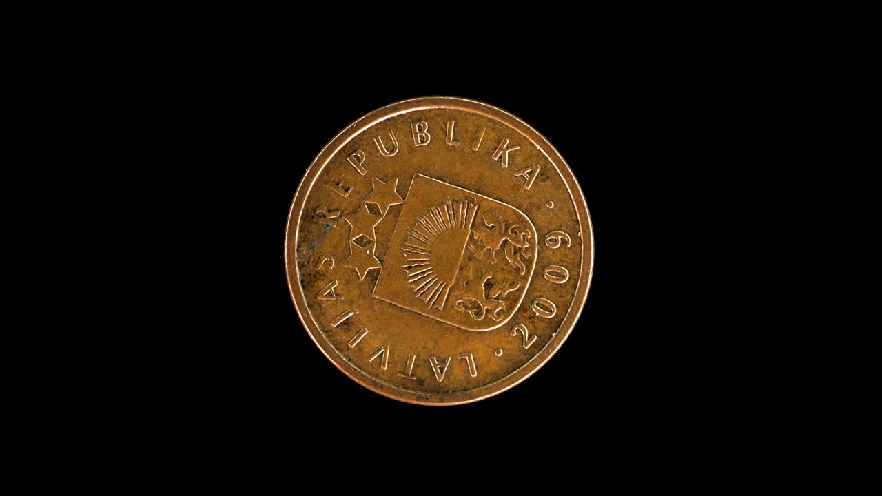Latvia 2009 2 santimi coin obverse displaying small coat of arms rotating on black background