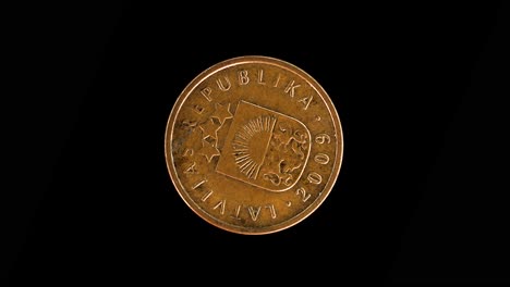 Latvia 2009 2 santimi coin obverse displaying small coat of arms rotating on black background