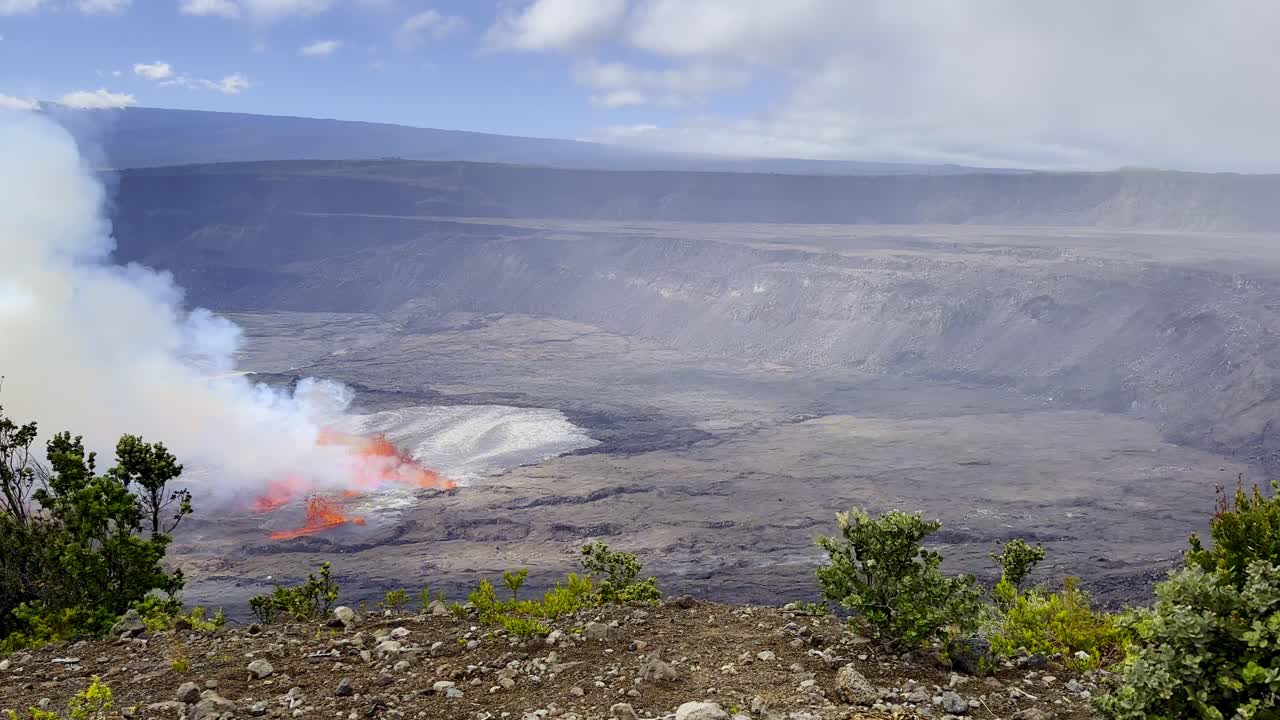 Cinematic wide panning shot of lava and volcanic gasses pouring from Kilauea mere moments after eruption began in September 2023 at Hawai'i Volcanoes National Park