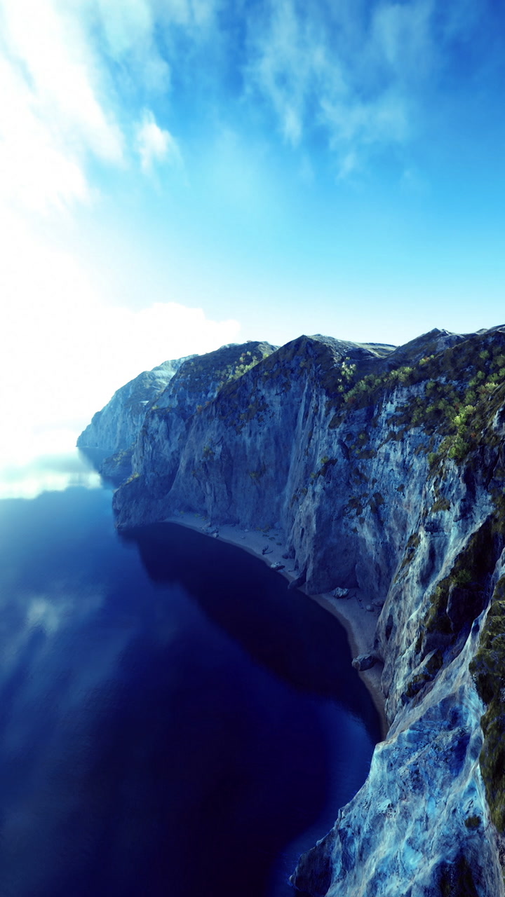 Breathtaking view of serene waters and majestic cliffs during a sunny day