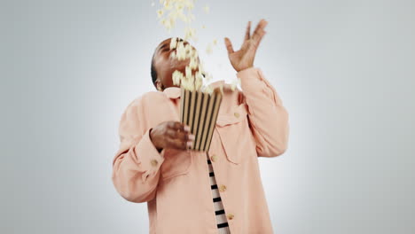 woman, popcorn and scared of horror in studio