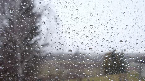 Pure-Rain-Droplets-On-Window-Glass-On-Rainy-Season