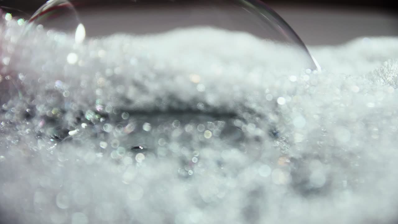 Artistic blur bubbles and dots with rotation slow motion and blue color copy space background