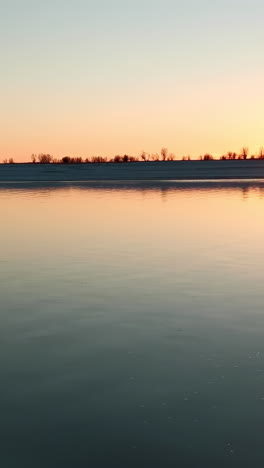 winter sunrise over a calm river